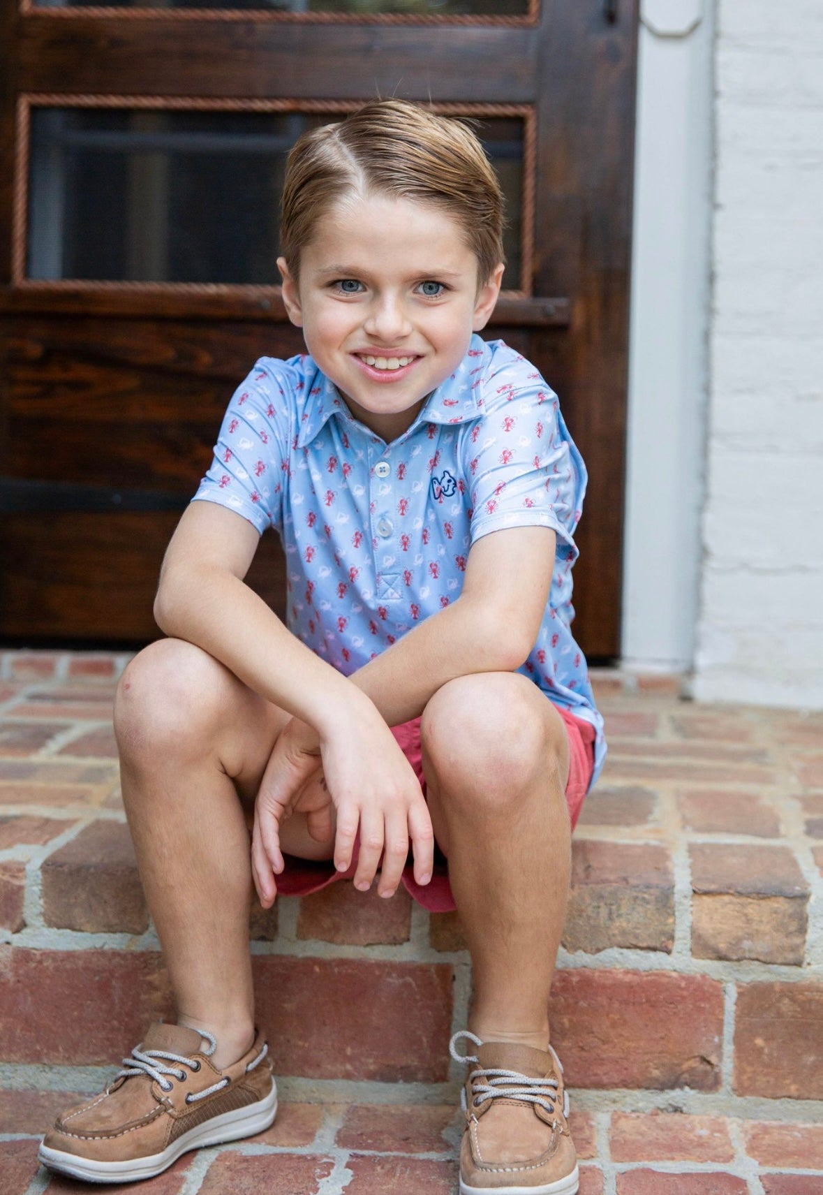 Boys Short Sleeve Pro Performance Polo in Crab and Lobster Print on Light Blue